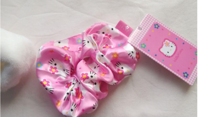 Sanrio Hello Kitty Scrunchie New with tag. Adorable pink hair tie for any occasion.