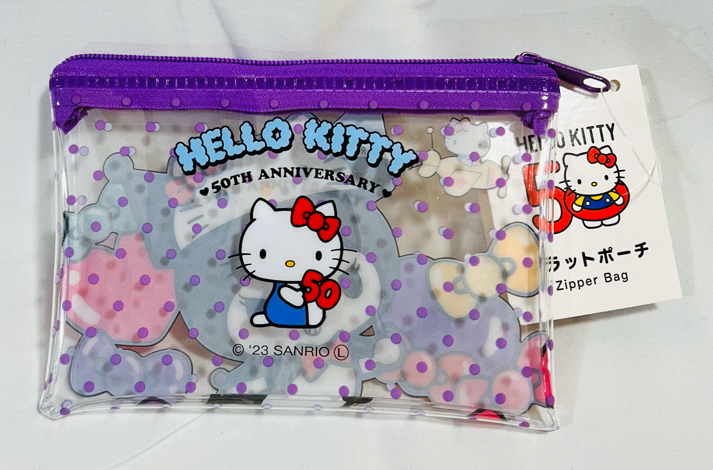 Kuromi Flat Zipper Pouch: Small but mighty, featuring the iconic kuromi aesthetic and Hello Kitty 50th Anniversary logo!